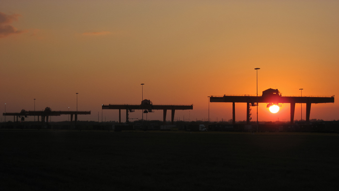 Large container cranes at sunset at the new BNSF intermodal facility in Gardner Kansas.