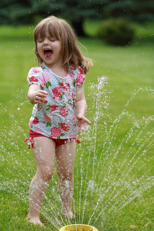 Lily enjoying a sprinkler. Memorial Day 2014