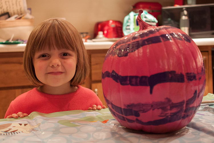 Lily was proud of her decorated pumpkin. 