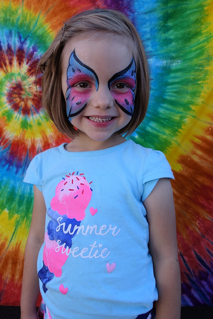 Lily with face paint from the Johnny Appleseed Festival.